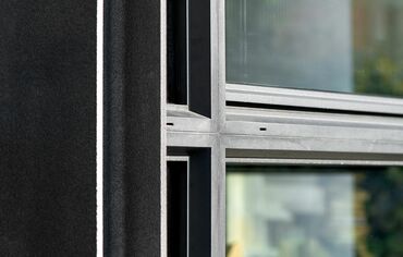 Detail of black aluminium window profiles, featured in the Italian Treviso villa.